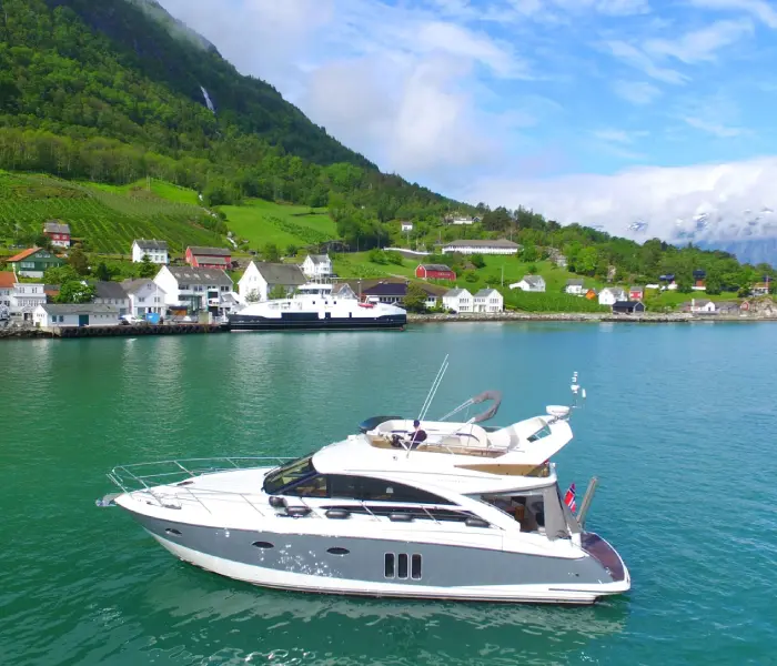 Private yacht crossing calm coastal water in Canada