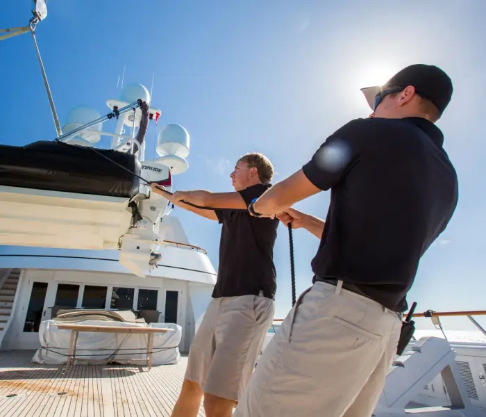 Crew preparing a private yacht for Canadian coastal travel